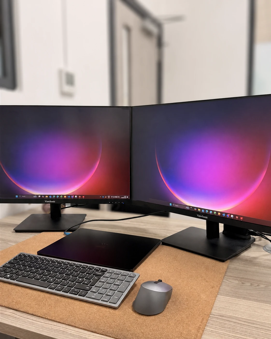 Dual-monitor workstation prepared for office use